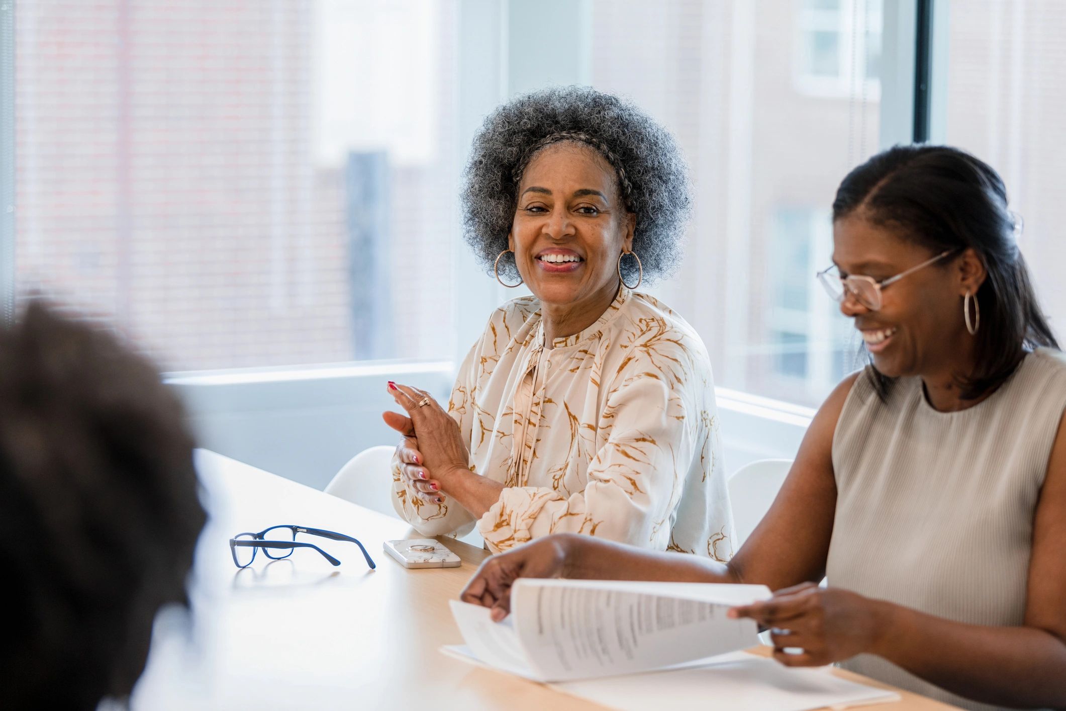 Executive reviewing documents with an advisor
